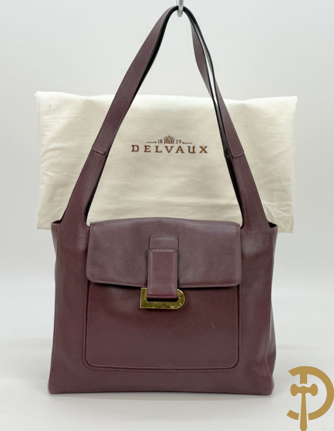 Mooi lederen auberginekleurige handtas Delvaux met bijhorende zak