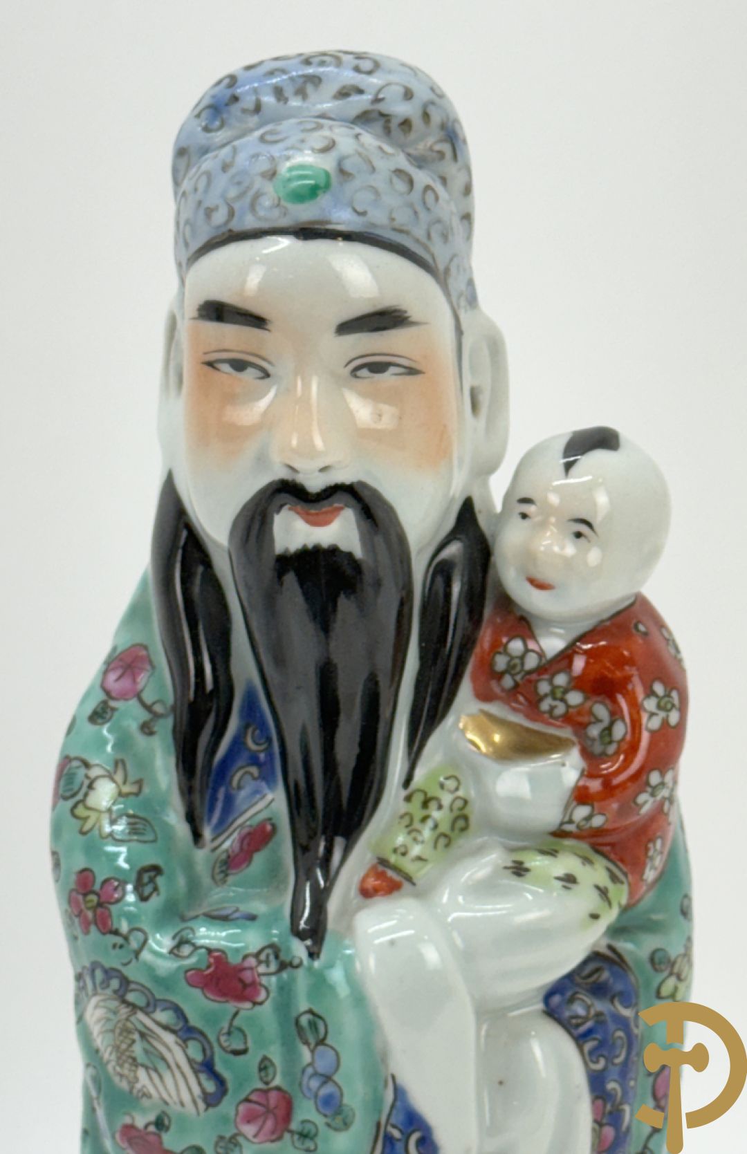 Chinese porseleinen wijsgeer met kind op de arm