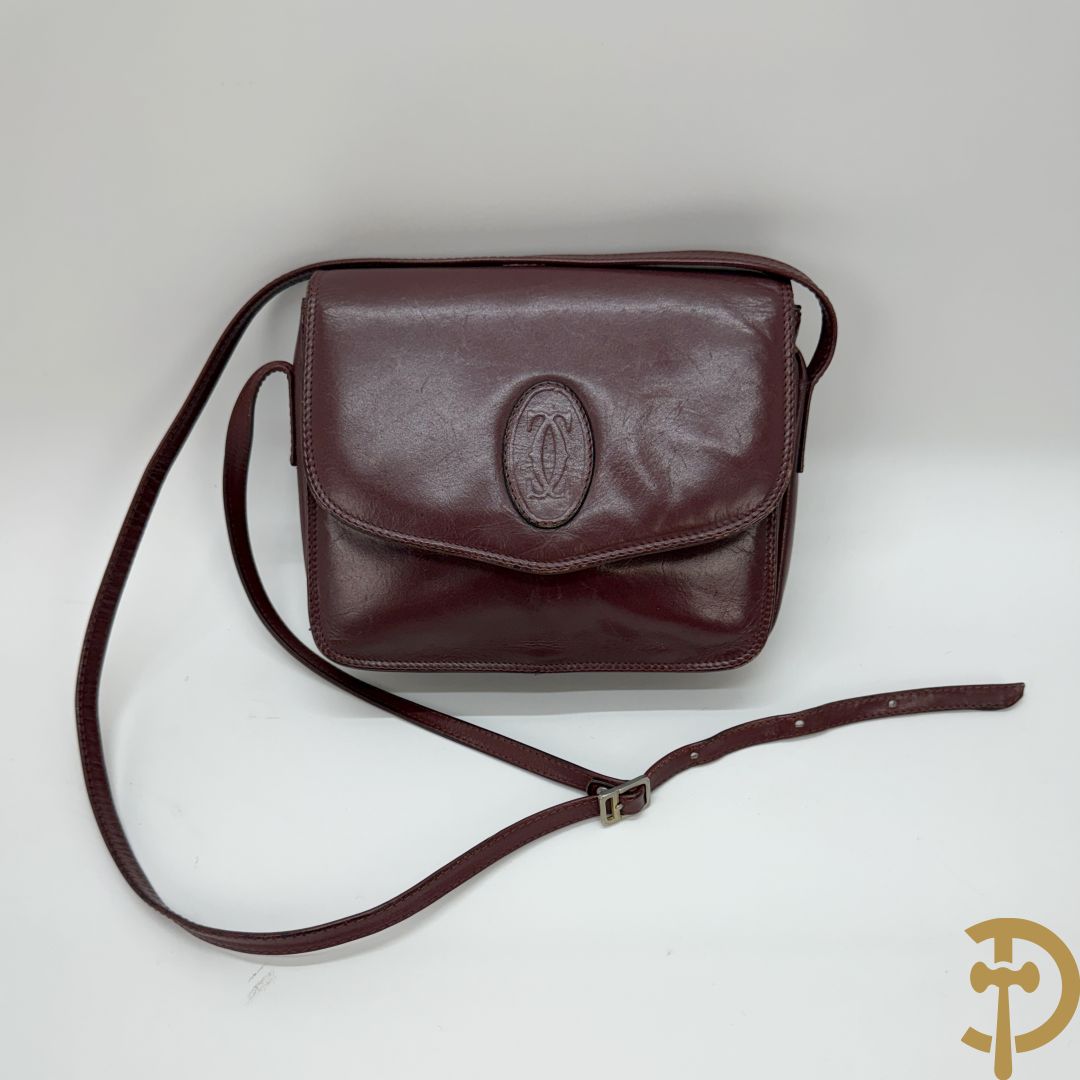 Bordeaux lederen aktentas Cartier + handtas Cartier