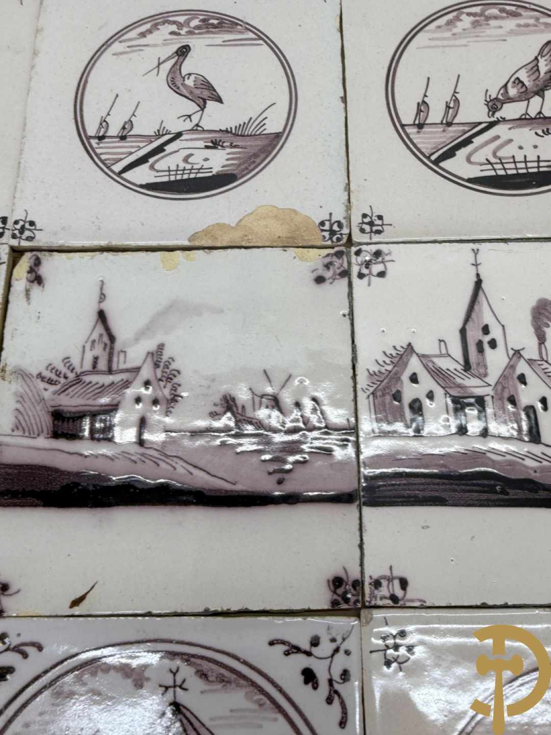 Verzameling zwart/witte Delftse tegeltjes met landschaps- en dierendecor