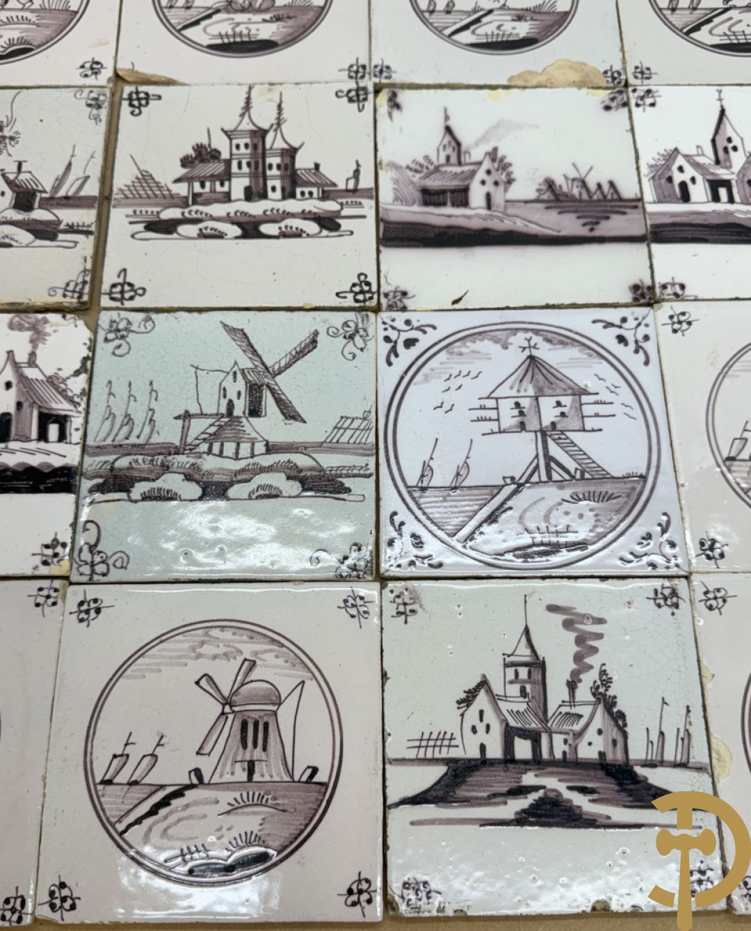 Verzameling zwart/witte Delftse tegeltjes met landschaps- en dierendecor