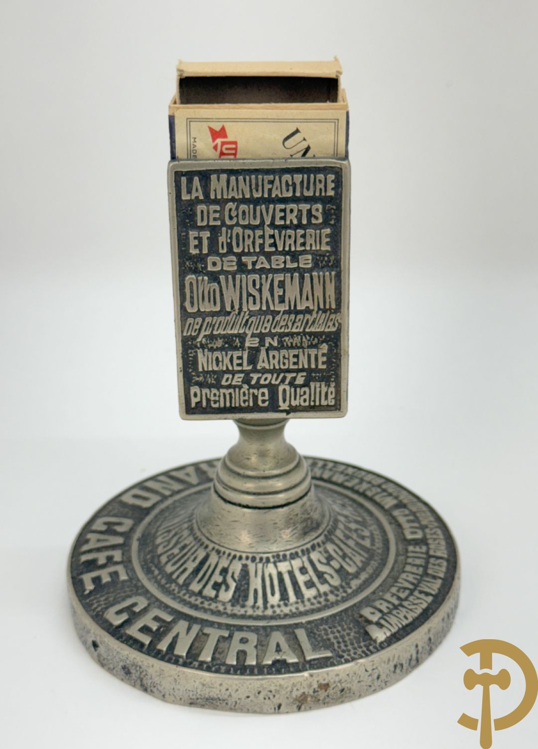Vier luciferhouders in verzilverd metalen met reclame opschriften van Wiskeman (2 x) , Orfeverie Van Den Torren en Orfeverie L. Haut