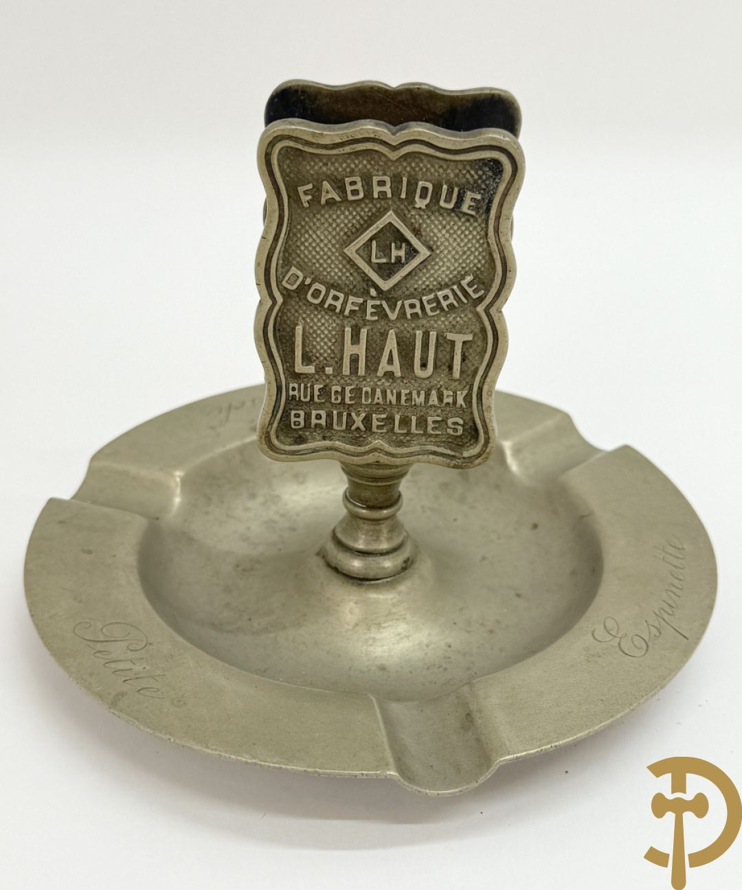 Vier luciferhouders in verzilverd metalen met reclame opschriften van Wiskeman (2 x) , Orfeverie Van Den Torren en Orfeverie L. Haut