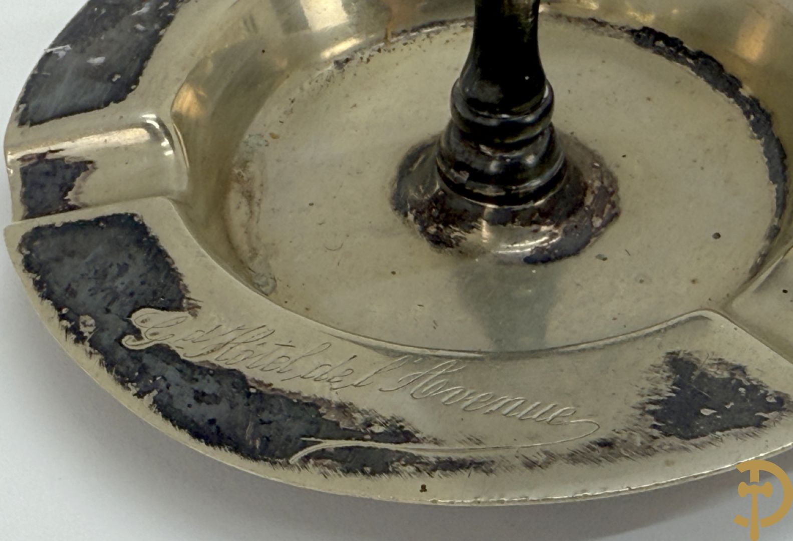 Vier luciferhouders in verzilverd metalen met reclame opschriften van Wiskeman (2 x) , Orfeverie Van Den Torren en Orfeverie L. Haut