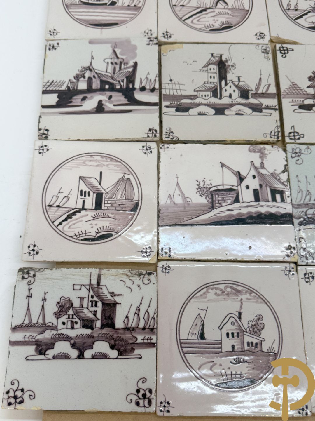 Verzameling zwart/witte Delftse tegeltjes met landschaps- en dierendecor