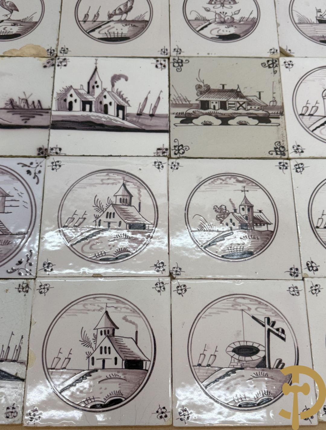Verzameling zwart/witte Delftse tegeltjes met landschaps- en dierendecor