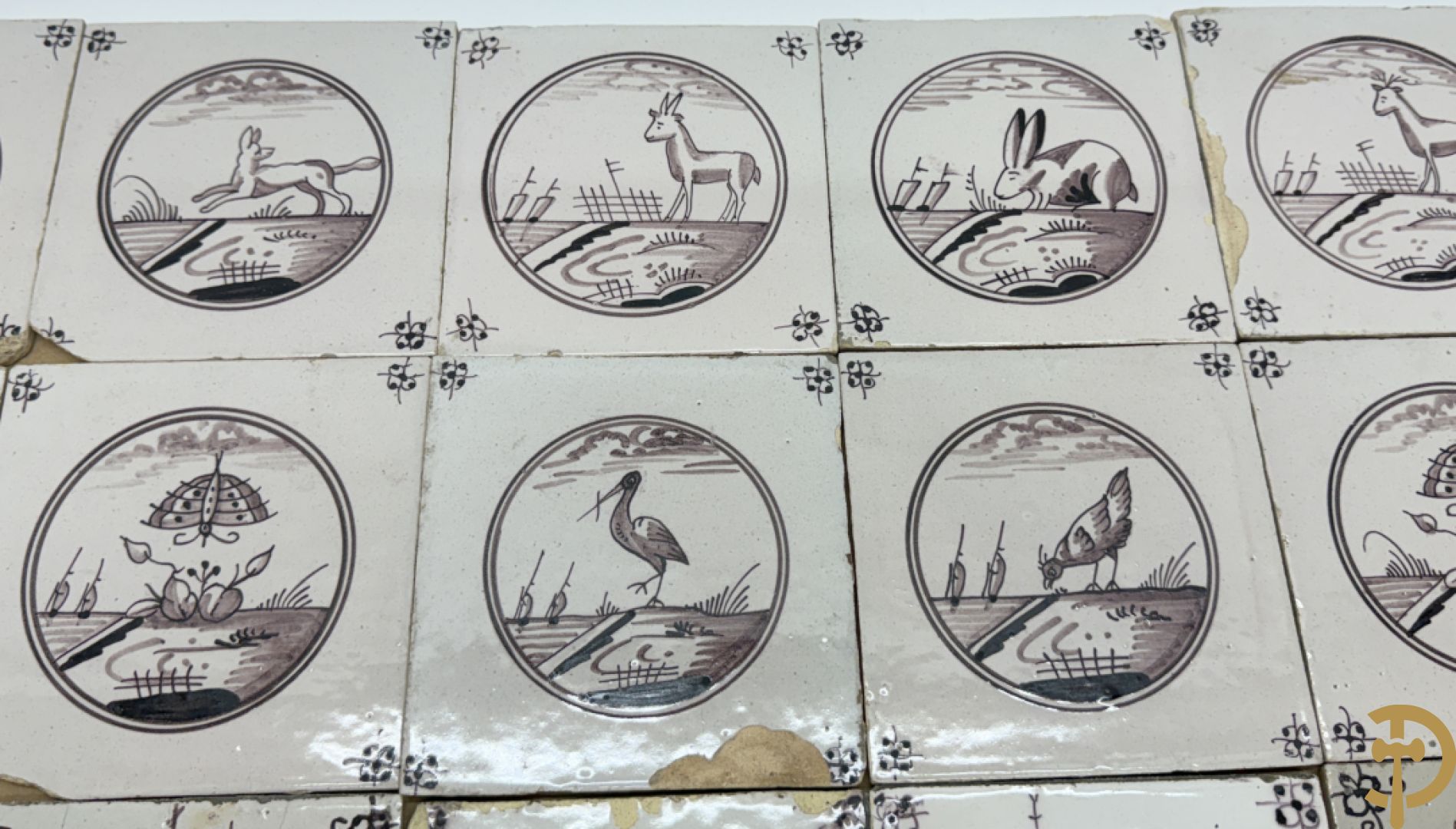 Verzameling zwart/witte Delftse tegeltjes met landschaps- en dierendecor