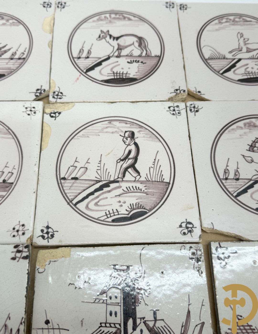 Verzameling zwart/witte Delftse tegeltjes met landschaps- en dierendecor