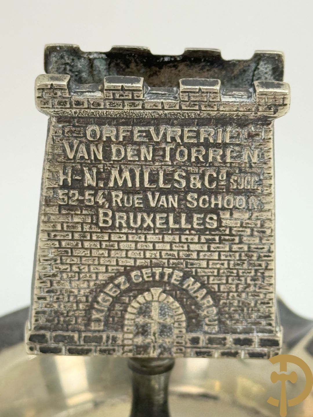 Vier luciferhouders in verzilverd metalen met reclame opschriften van Wiskeman (2 x) , Orfeverie Van Den Torren en Orfeverie L. Haut