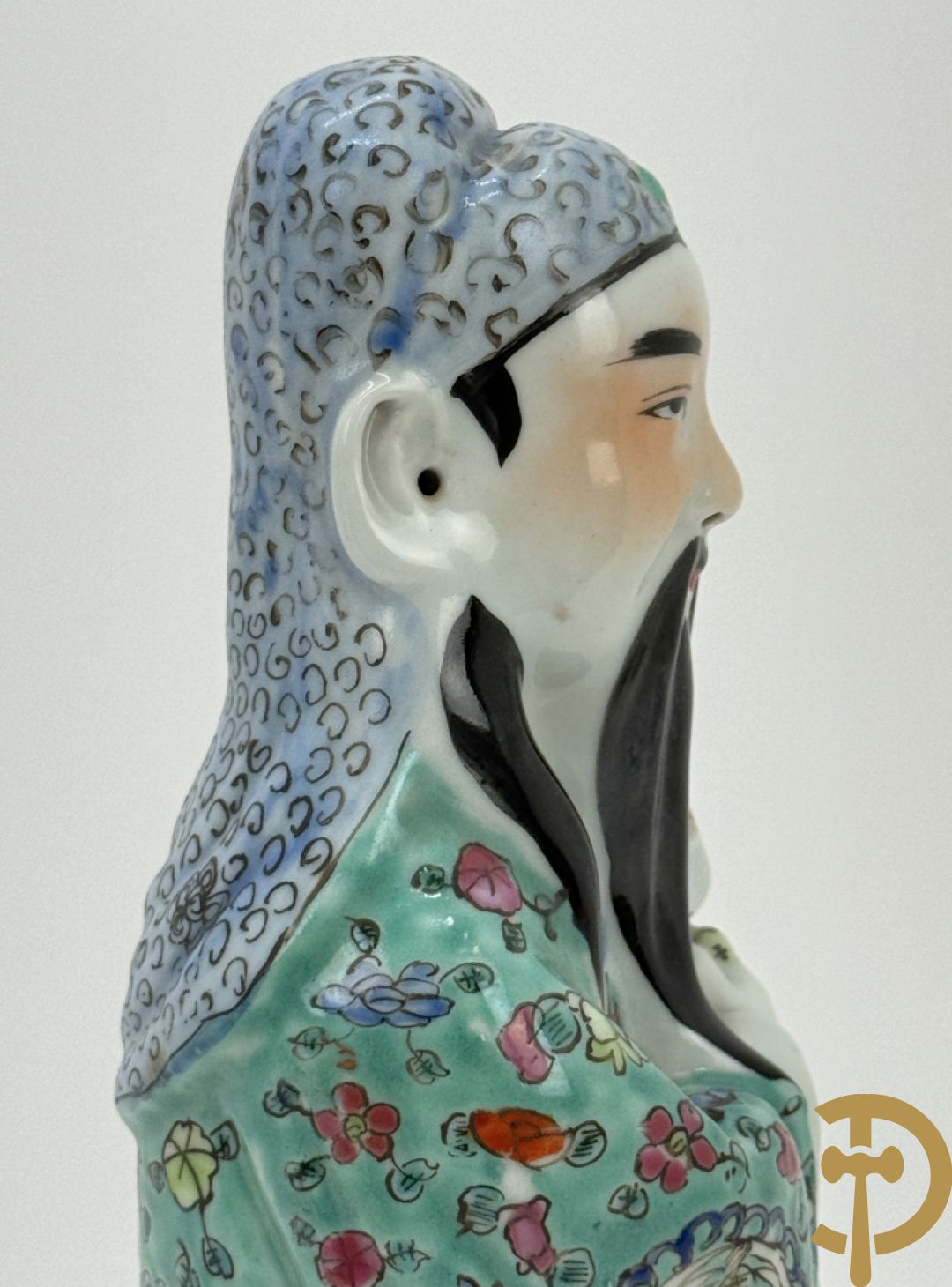 Chinese porseleinen wijsgeer met kind op de arm