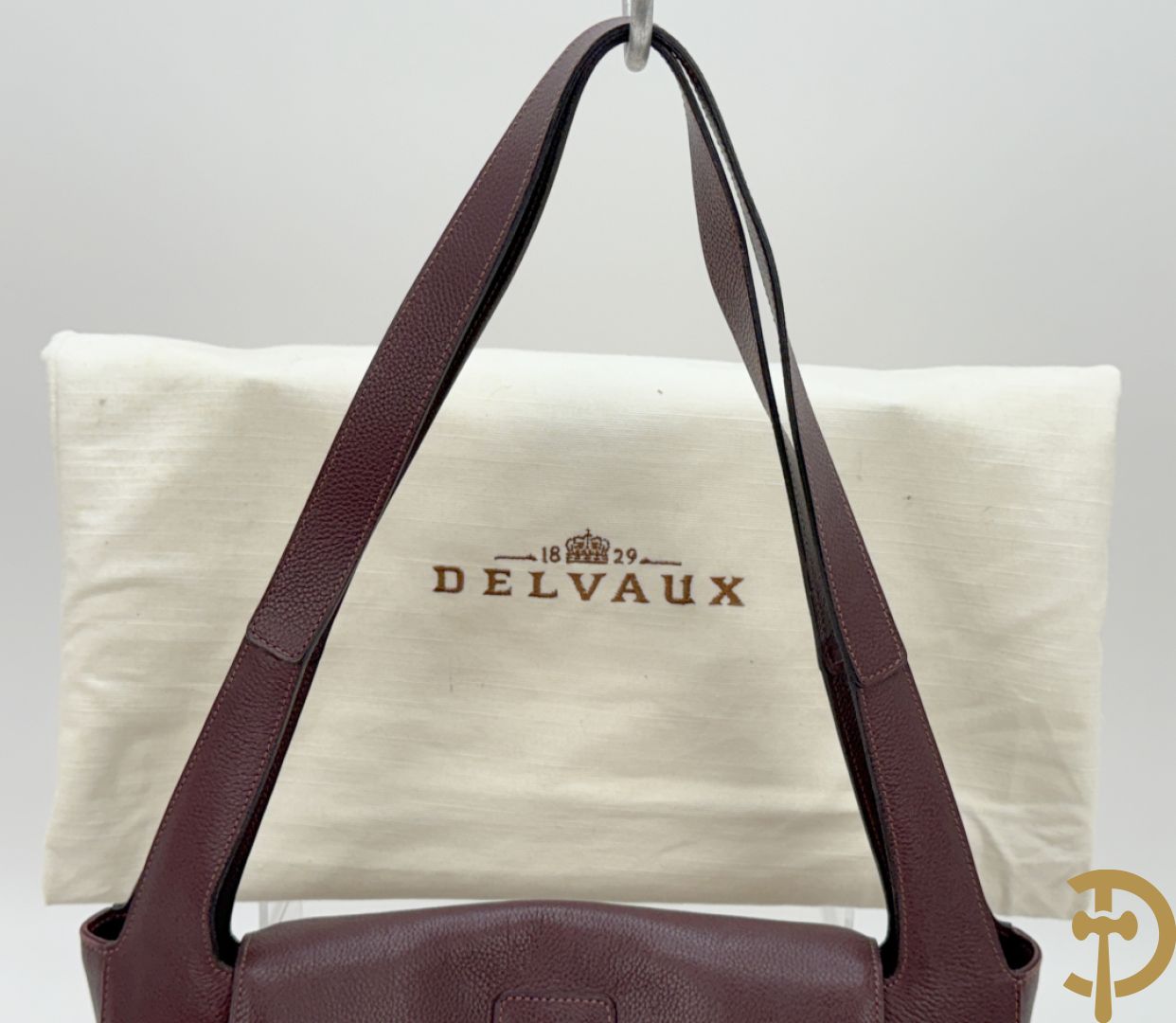 Mooi lederen auberginekleurige handtas Delvaux met bijhorende zak