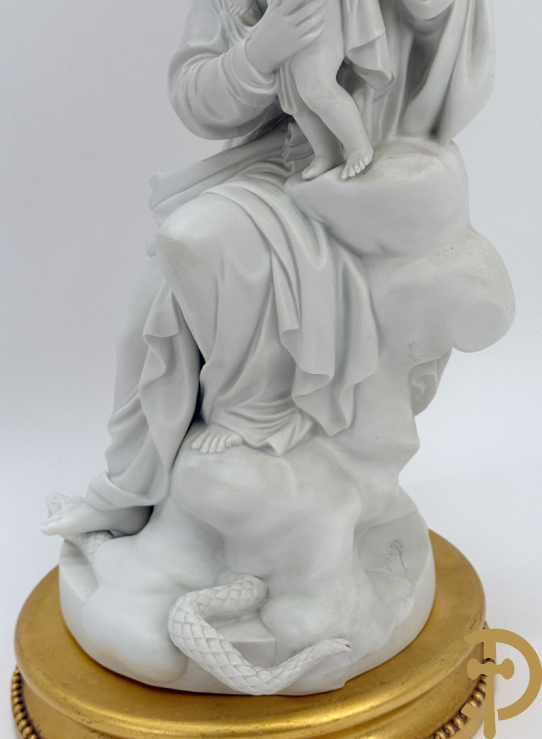 Boizet getekend, witte biscuit van Madonna met kind steunende op slang, gemerkt Sèvres, op vergulde sokkel