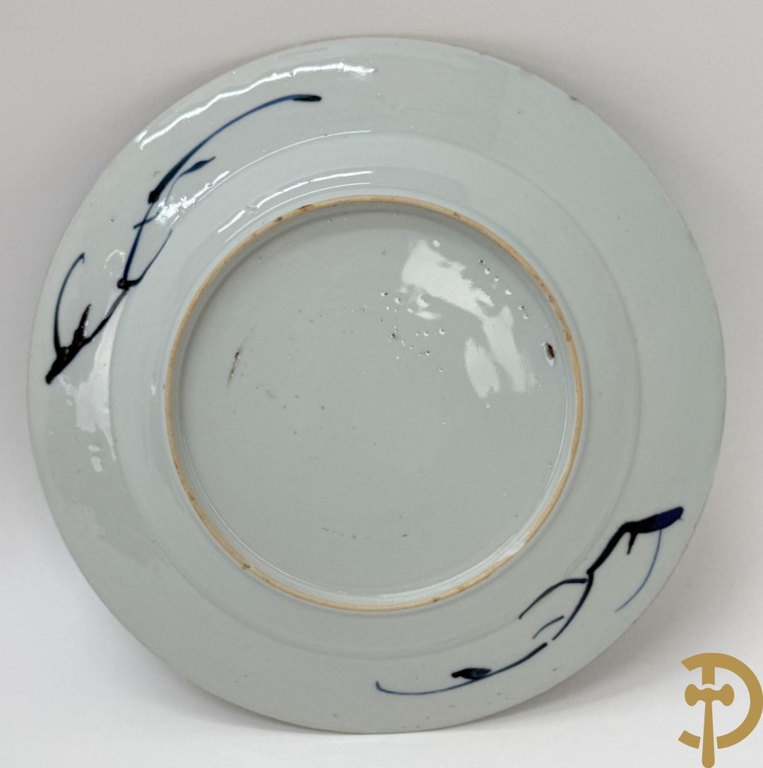 Acht Chinese porseleinen blauw/wit bordjes met bloemendecor, Kangxi