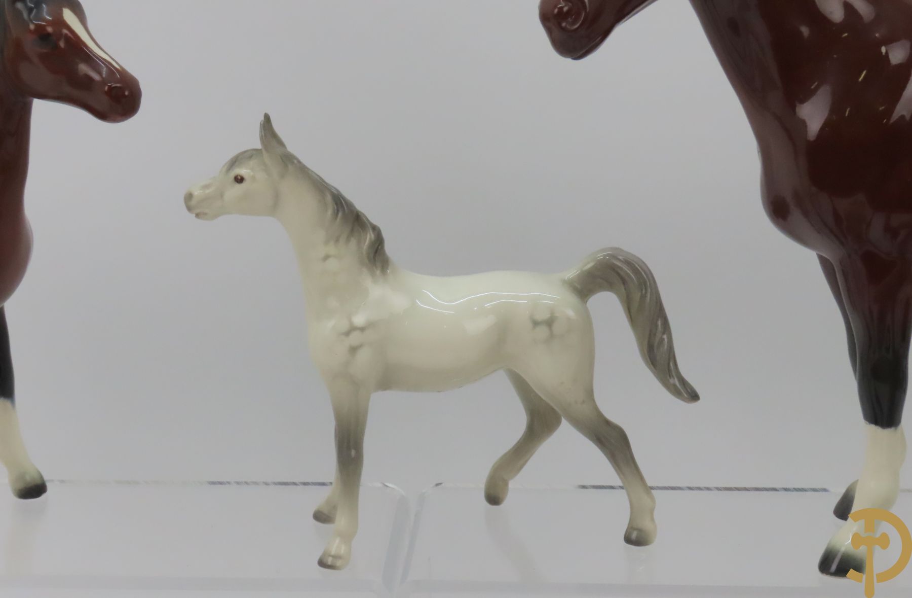 Twaalf porseleinen paarden, onderaan getekend Goebel West Germany