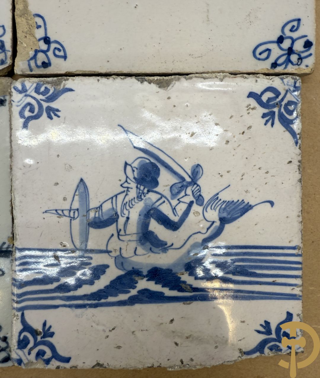 Negen Delftse tegeltjes met geanimeerd decor (6 stuks) en landschappen (3 stuks)